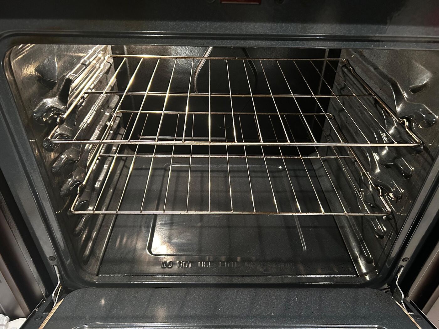 Sparkling clean oven interior and racks after deep cleaning